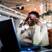 Young businesswoman working with headache young businesswoman working with headache