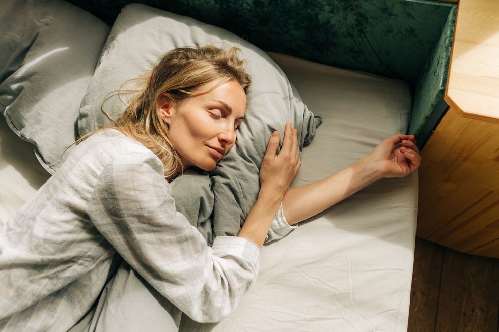 young caucasian woman is sleeping the concept of a healthy daytime sleep