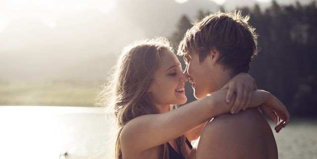 Young couple about to kiss in a natural environmen