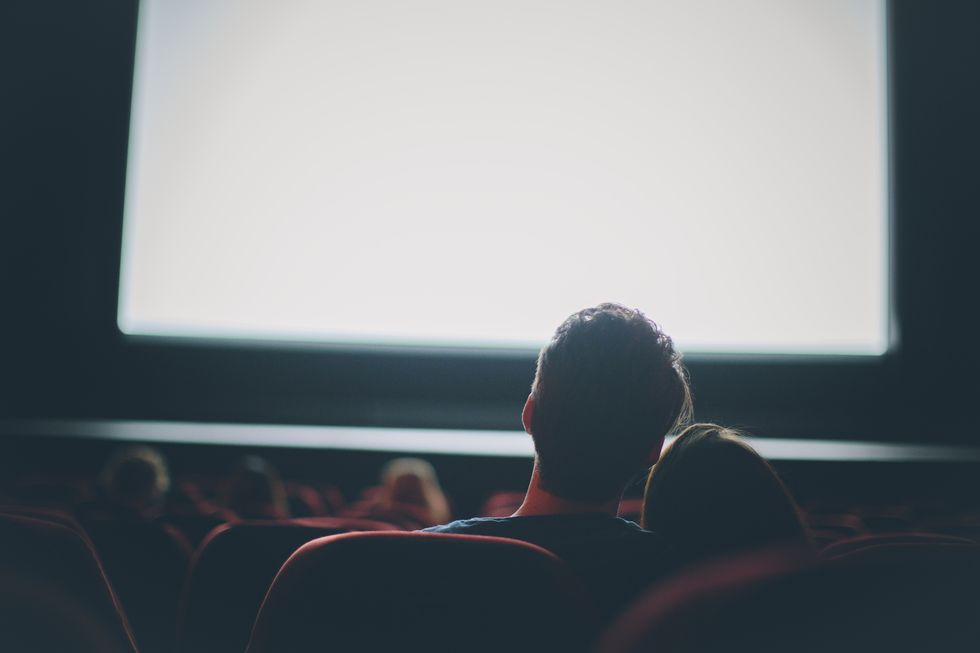 young couple at movie together