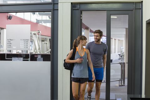 Young couple coming out from a fitness club