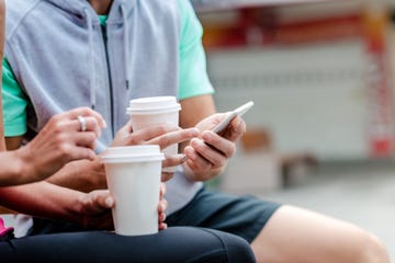 Young couple drinking coffee to go