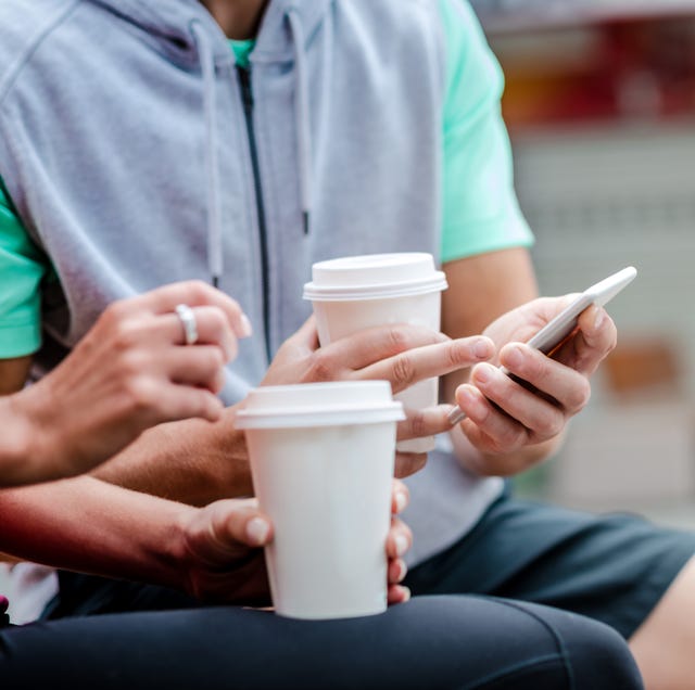 Young couple drinking coffee to go