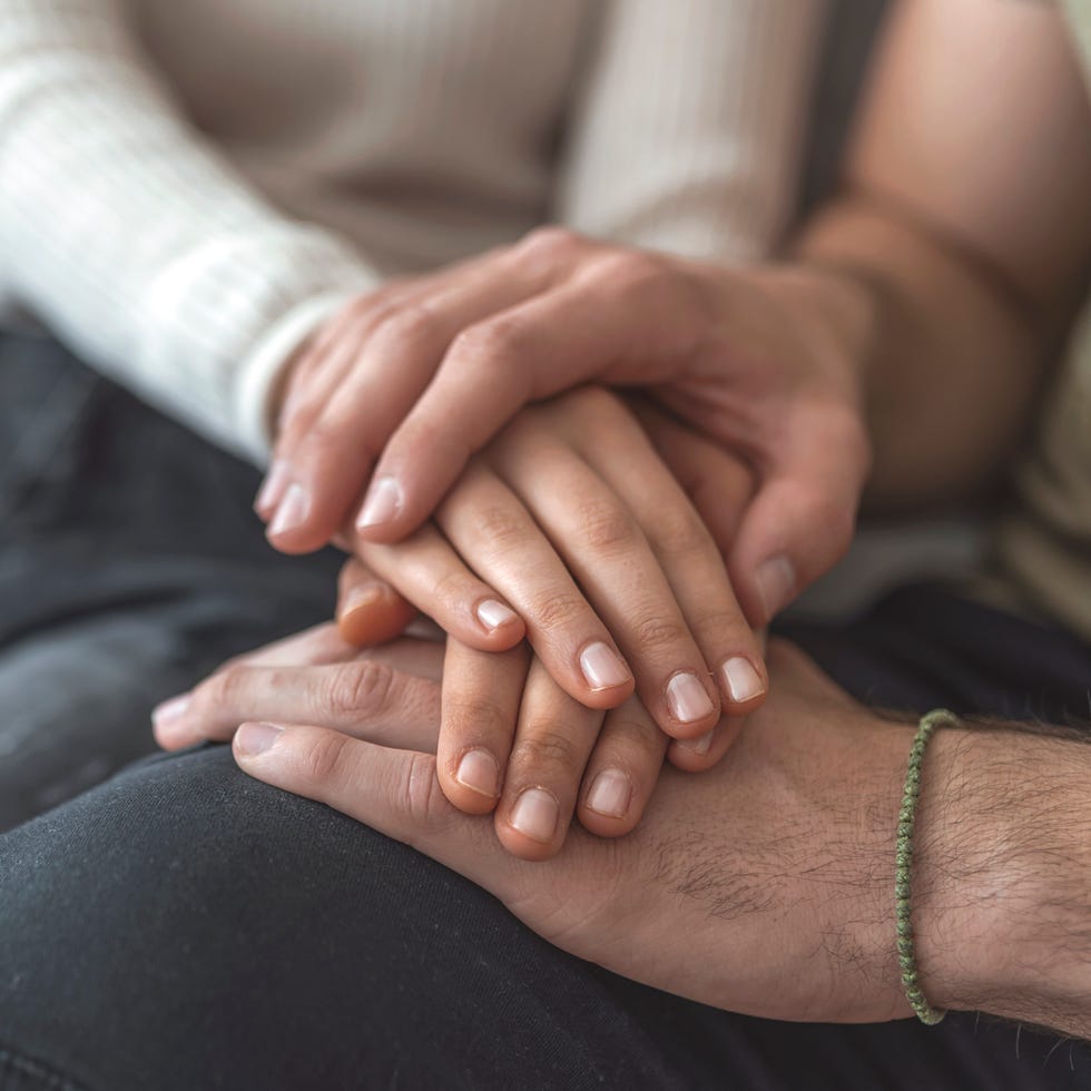 A young couple hand by hand.