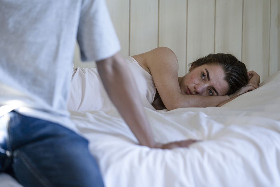 young couple having relationship difficulties in the bedroom