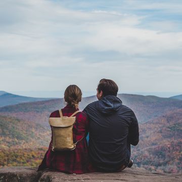 a young couple relaxing in nature in autumn