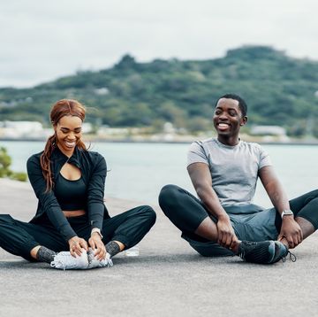 young couple stretching before or after running French or jogging