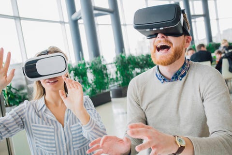 couple wearing virtual reality glasses