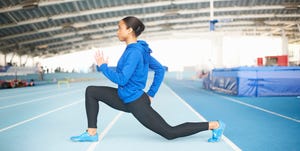 young female athlete lunging
