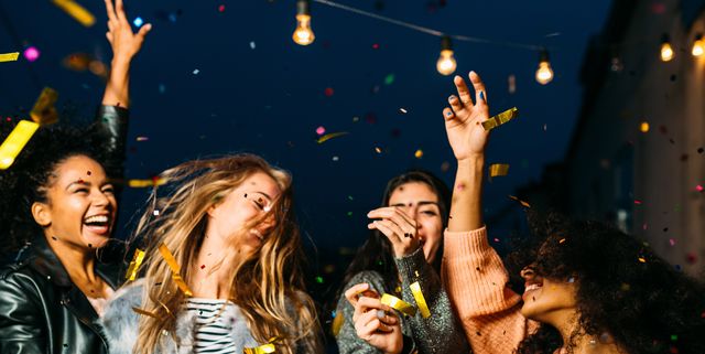 Young Female Friends Enjoying Party At Night