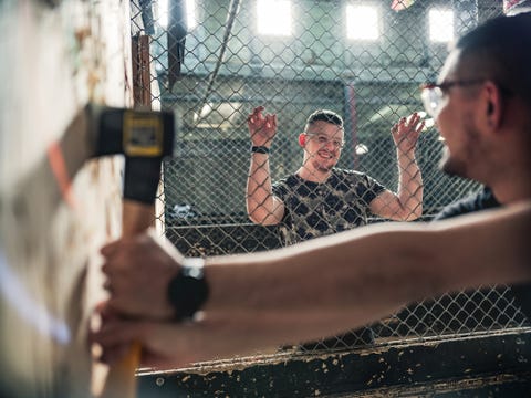 couple at the axe throwing game room