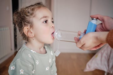 young girl receiving respiratory treatment at home