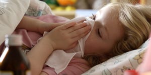 young girl 4 5 years sick in bed with medicine