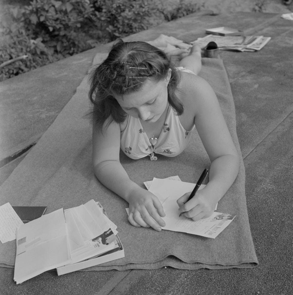 Young Girl Writing to Boyfriend Back Home while Away at Summer National Music Camp, Interlochen, Michigan