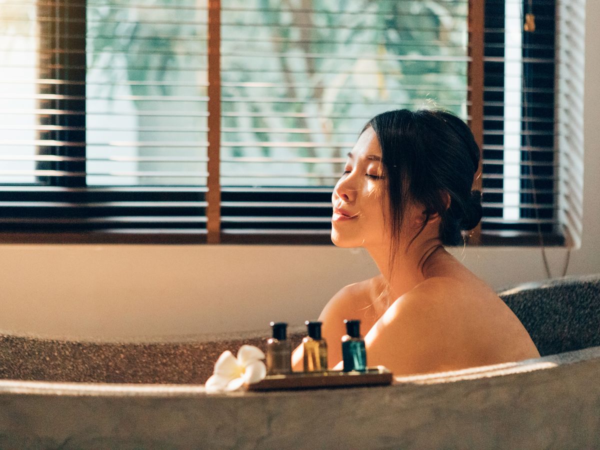 https://hips.hearstapps.com/hmg-prod/images/young-happy-woman-enjoying-in-bubble-bath-in-hotel-royalty-free-image-1629838033.jpg?crop=0.88889xw:1xh;center,top&resize=1200:*