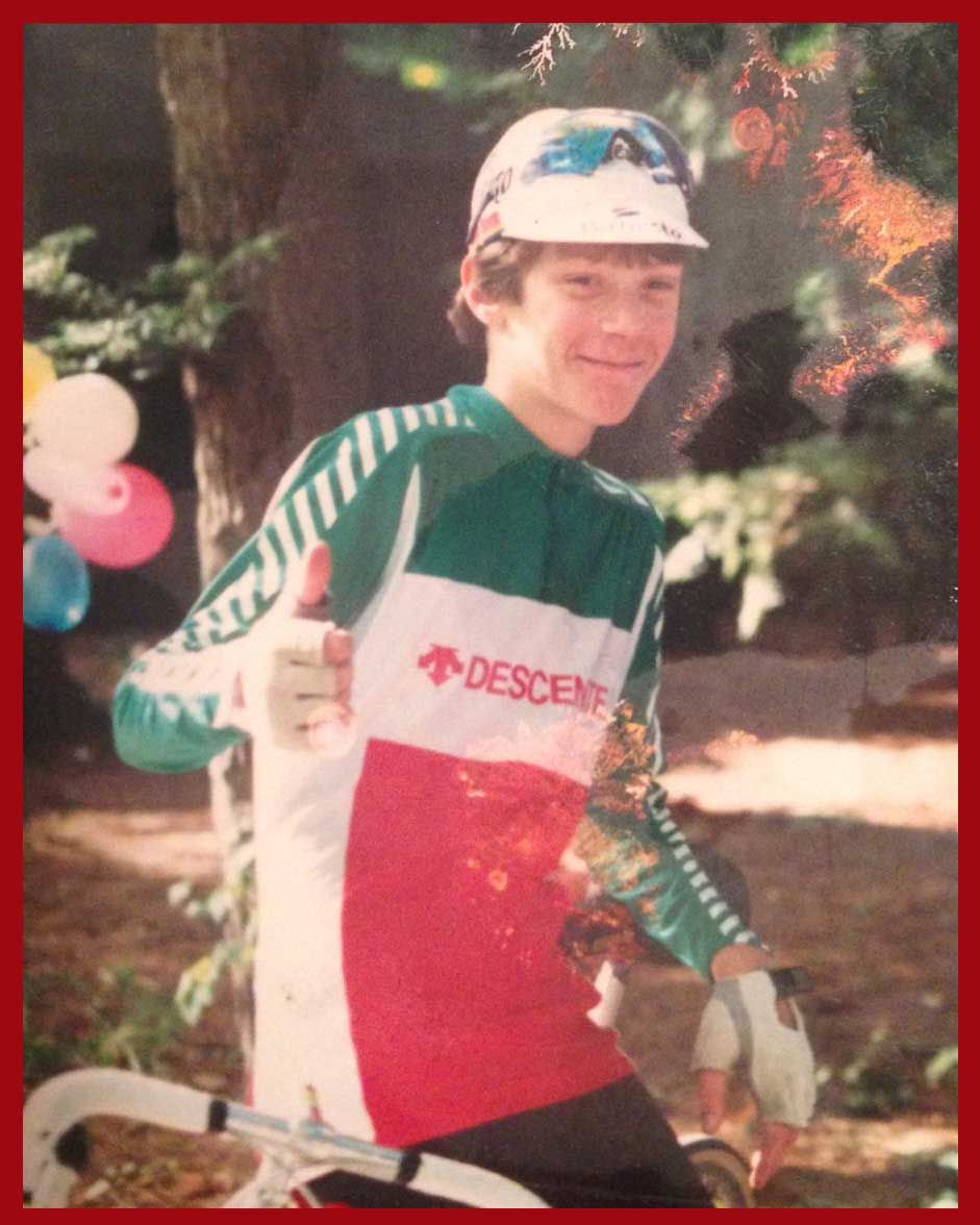 a young james jung in a cycling jersey