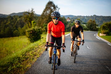 young male and female friends enjoying rural cycling workout
