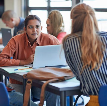 young man and woman looking at university student