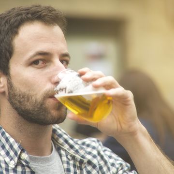 young man drinking beer
