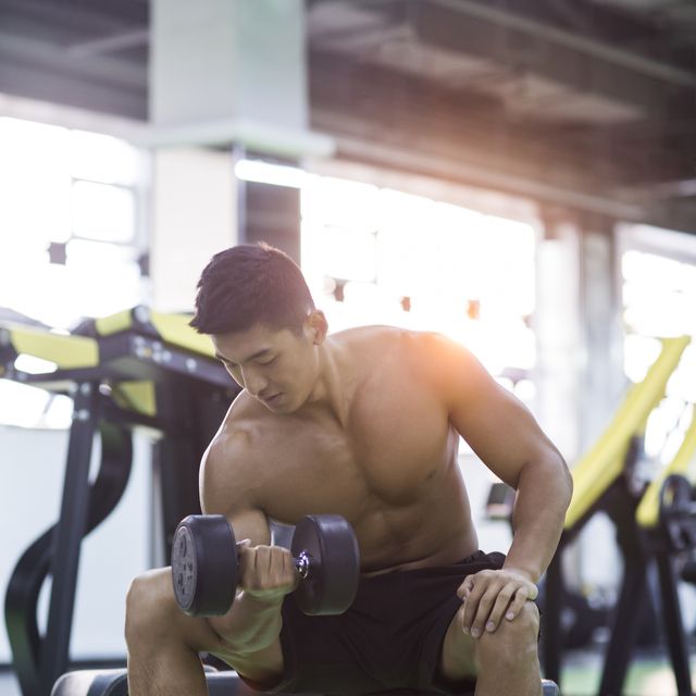 Young man exercising at gym
