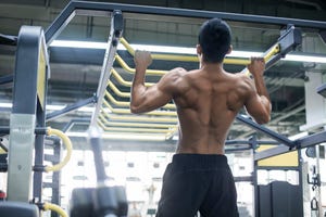 young man exercising at gym