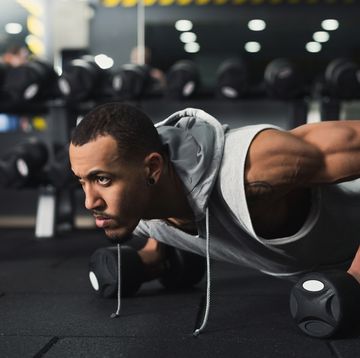 young man fitness workout, push ups or plank