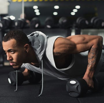 young man fitness workout, push ups or plank