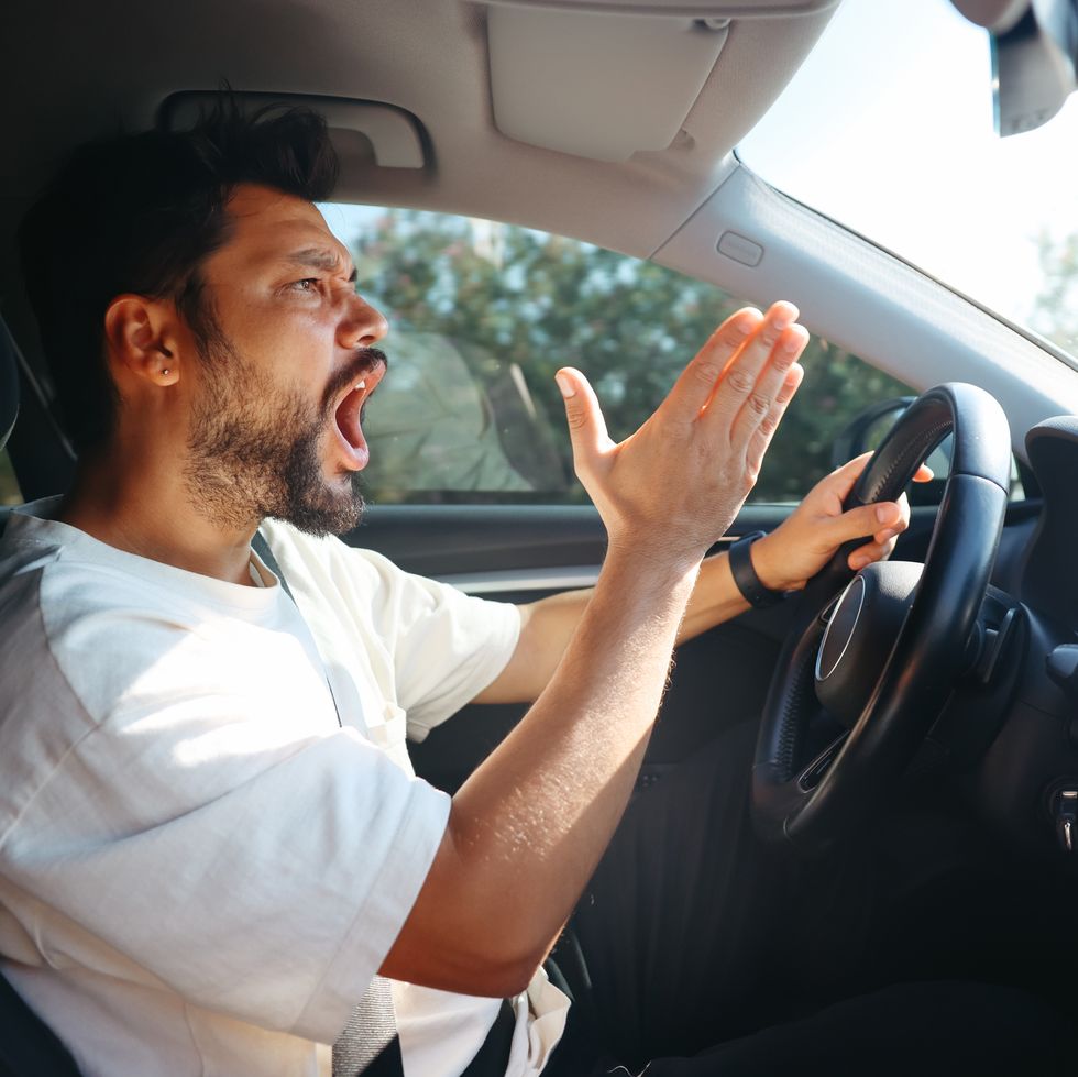 young man getting angry on the road