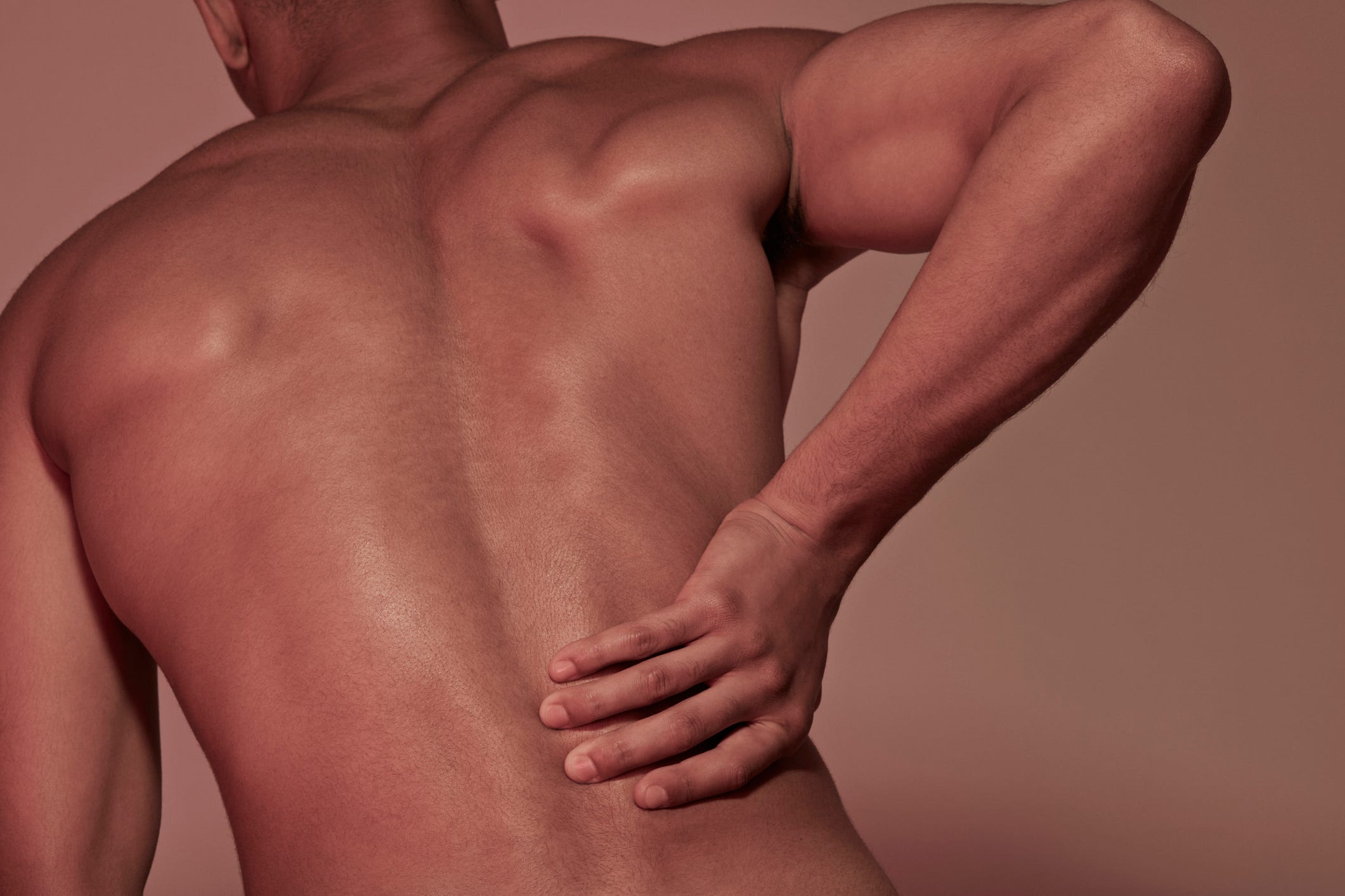 young man having back pains