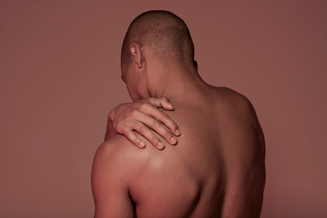 young man having shoulder pain
