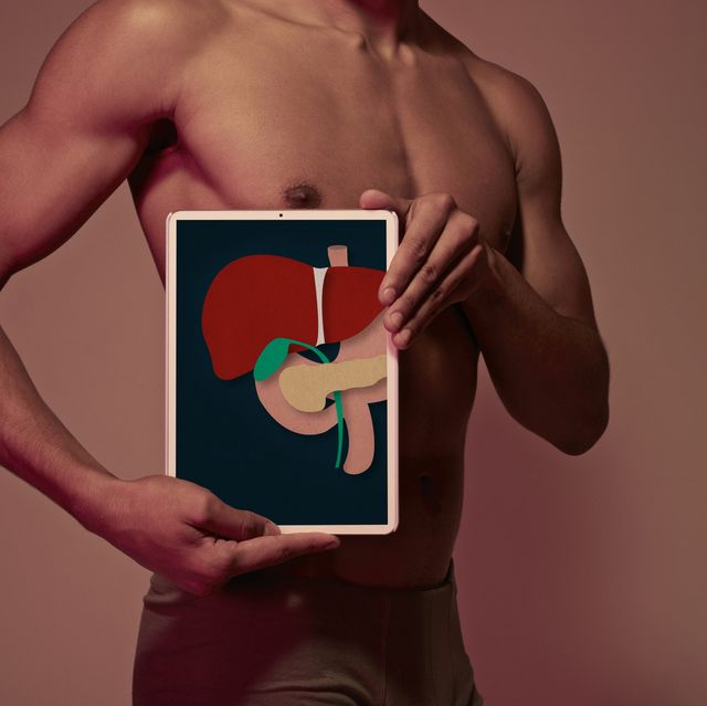 young man holding tablet in front of body to display liver