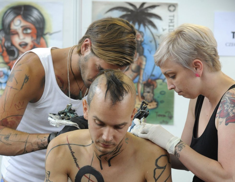 a young man is tattooed during the 13th
