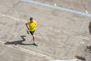 young man jogging, concrete floor