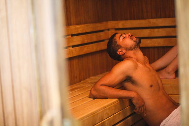 Young man relaxing at sauna