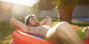 young man relaxing in pool