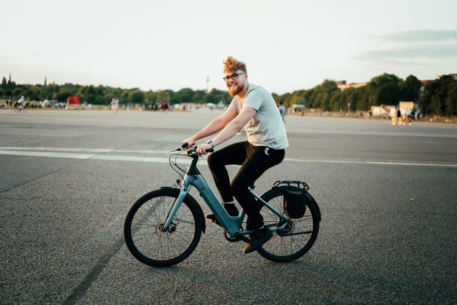 young man riding an electric bike outdoors