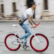 Young man riding bicycle in the city
