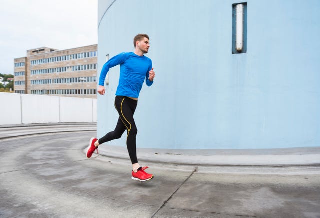 Young man running in the city