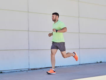 young man running in the street workout concept