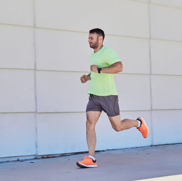 young man running in the street. workout concept