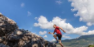 young man running Footbed on mountain
