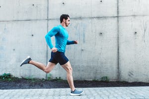 young man running outdoors in morning