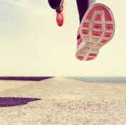 Young man running outdoors, mid air, low section Young man running outdoors, mid air, low section