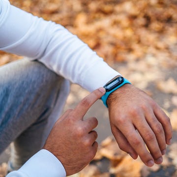 young man using a fitness tracker