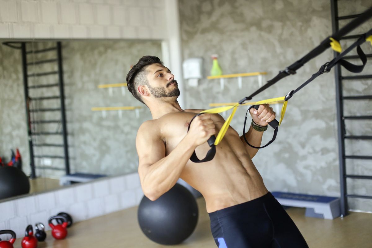 Young muscular man exercising