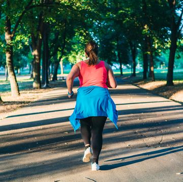 young overweight woman running