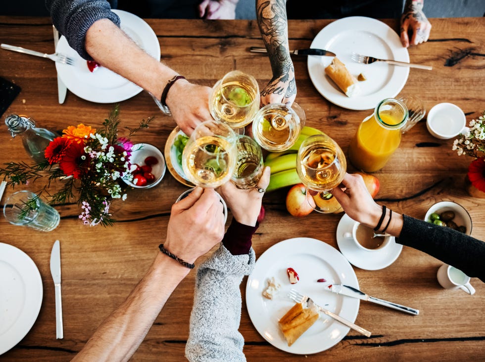 young people having a toast with a glass of wine