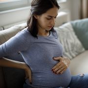 young pregnant woman suffering from backache