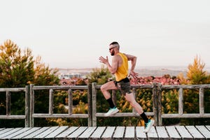 young sportsman along with boardwalk