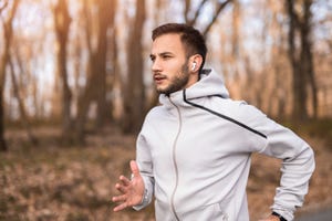 young sportsman running in nature